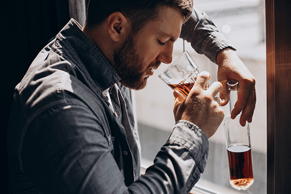 man-drinker-depressed-with-bottle-whiskey